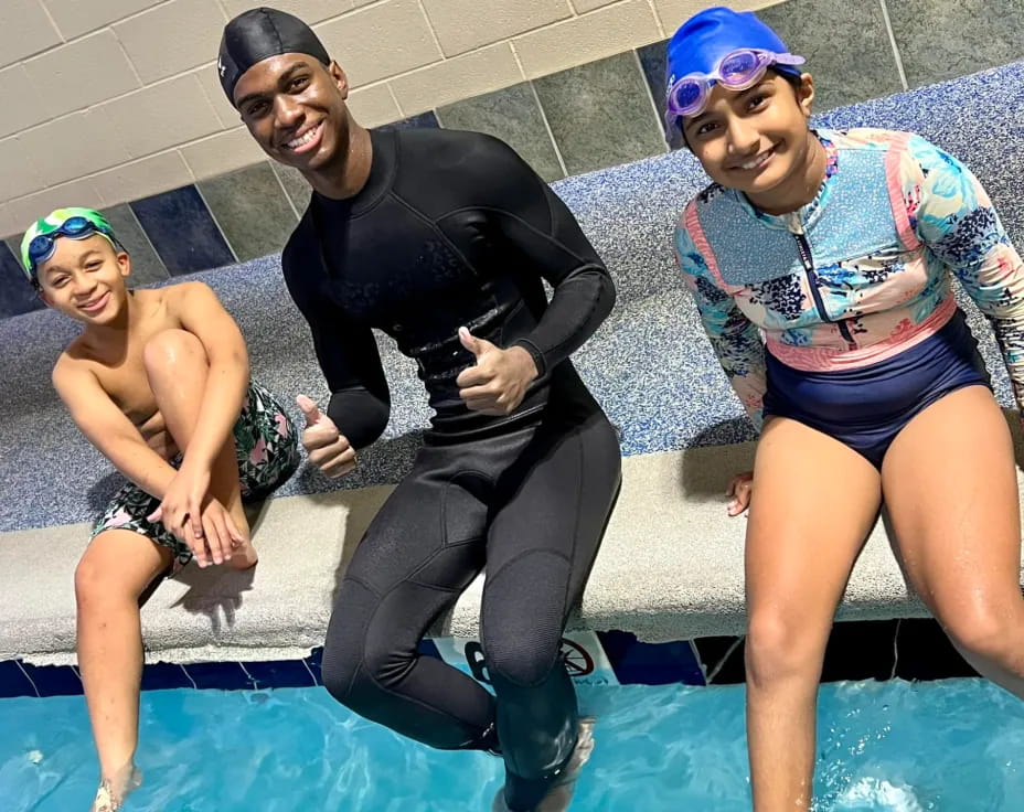 a group of people in a pool