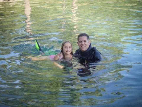 a person and a girl in water