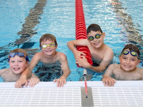 a group of kids in a pool