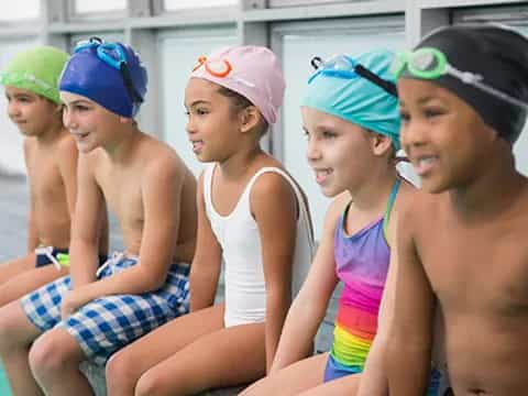 a group of people sitting in a pool