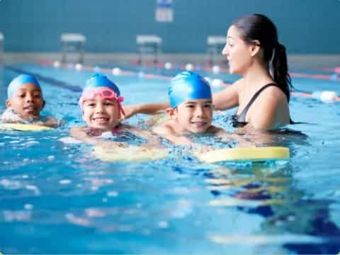 a group of children in a pool