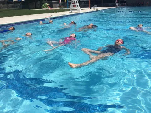 a group of people in a pool