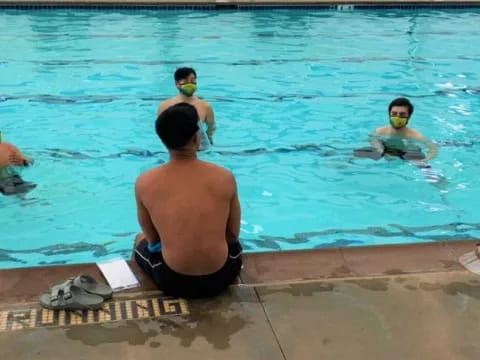 a group of people in a pool