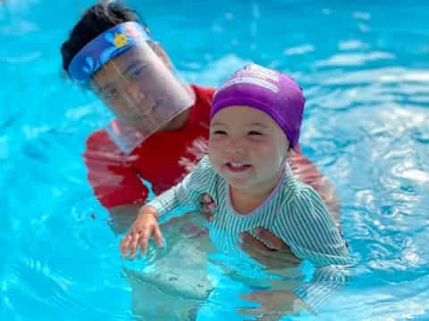 a baby in a pool