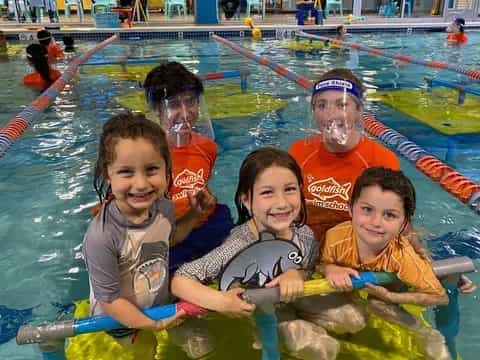 a group of kids in a pool