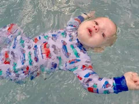 a baby in a pool