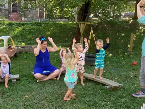 a group of children playing in a yard