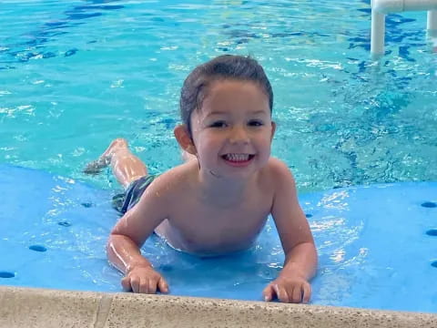 a boy in a pool