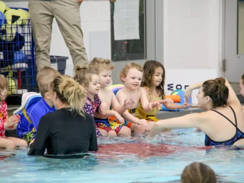 a group of children in a pool