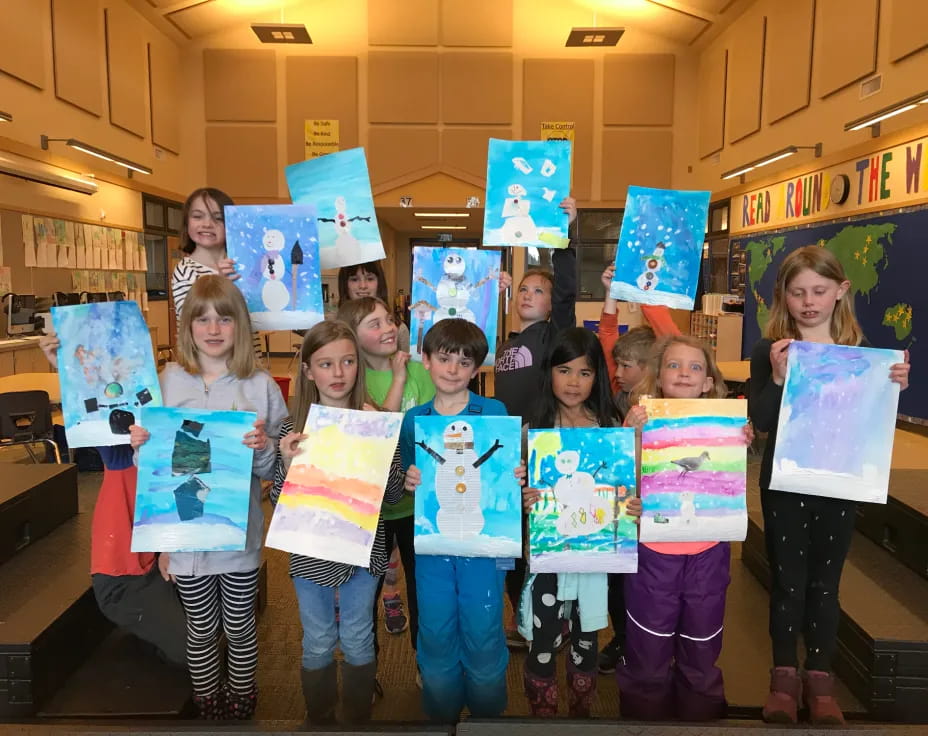 a group of children holding signs