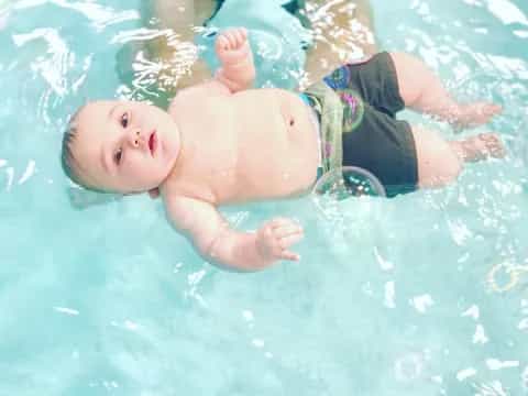 a baby in a pool