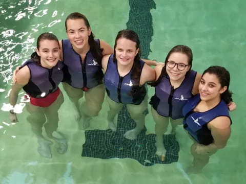 a group of girls in a pool