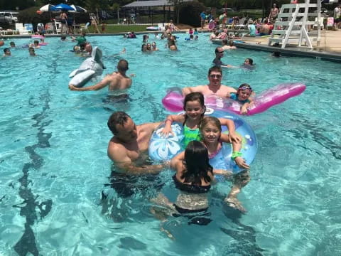 a group of people in a pool