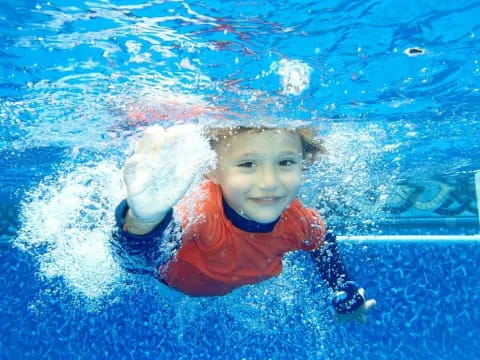 a boy in a pool