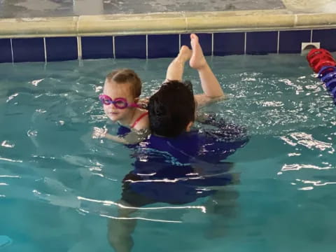 a couple of people in a pool