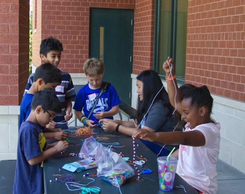 a group of children around a table