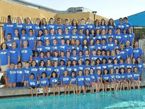 a group of people in blue shirts