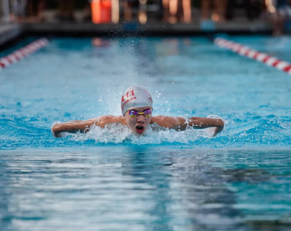 a person swimming in a pool