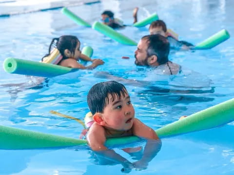 a group of people in a pool