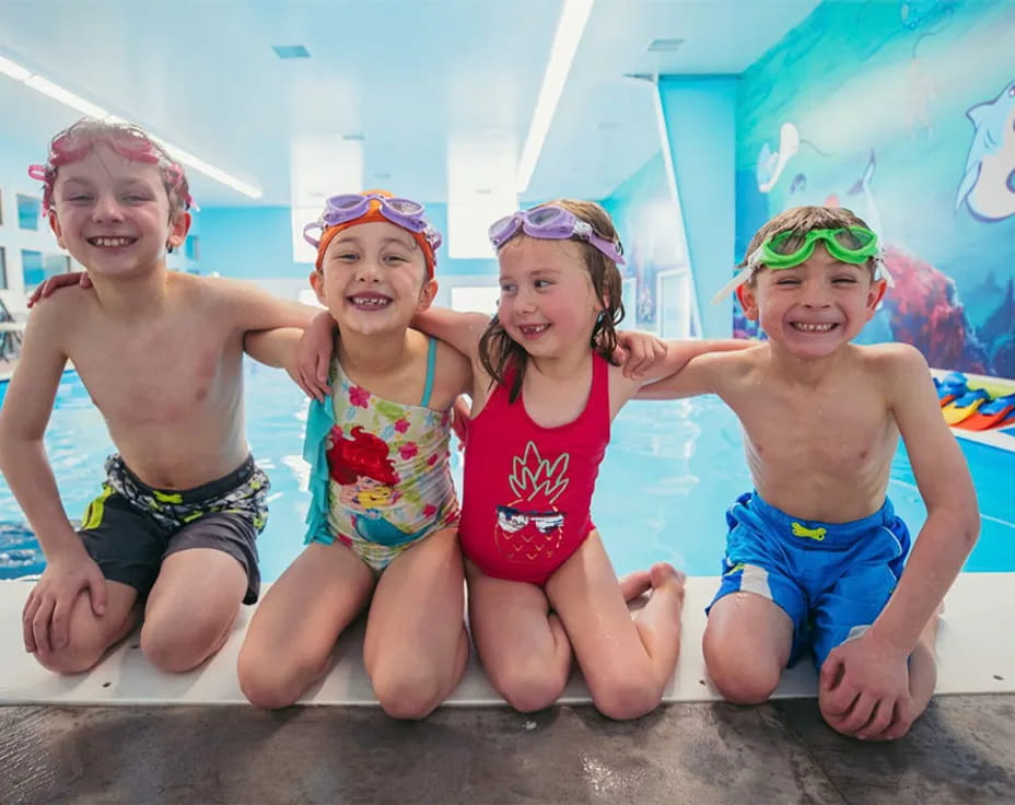 a group of children in a pool