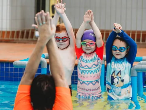 a group of kids in a pool