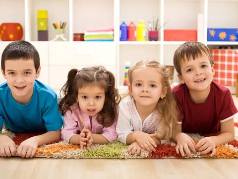 a group of children sitting on the floor