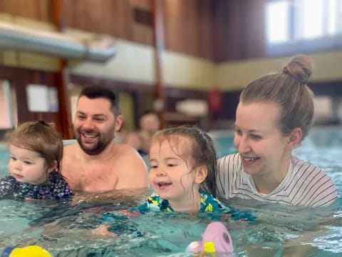 a group of people in a pool