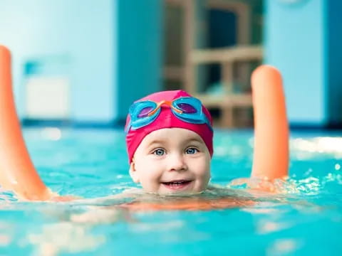 a baby in a pool