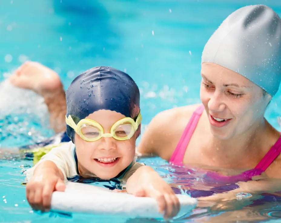 a couple of kids in a pool