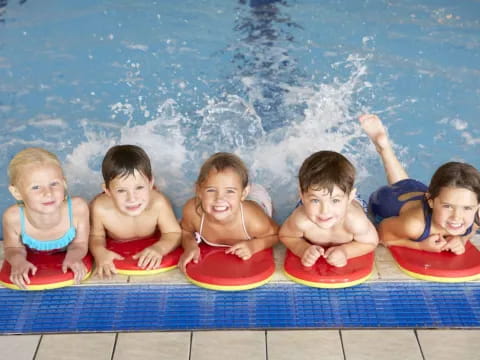 a group of kids in a pool