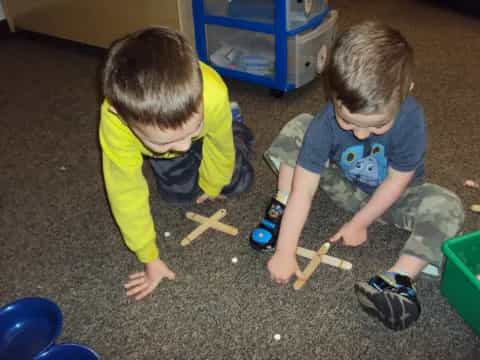 a couple of kids playing with toys