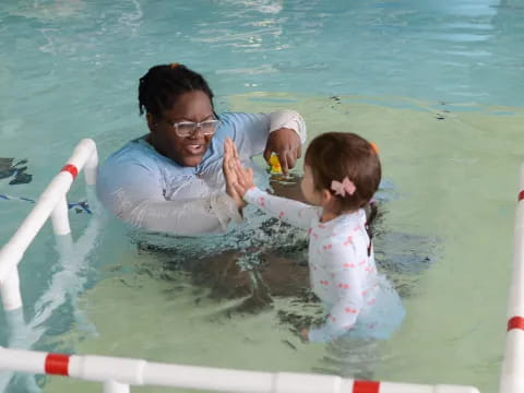 a person and a girl in the water