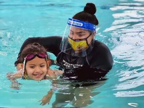 a person and a child in the water