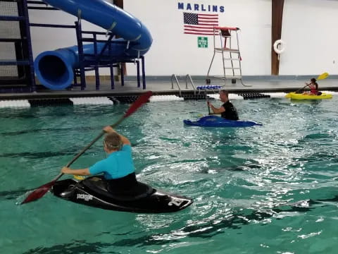 a group of people in kayaks