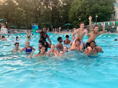 a group of people in a pool