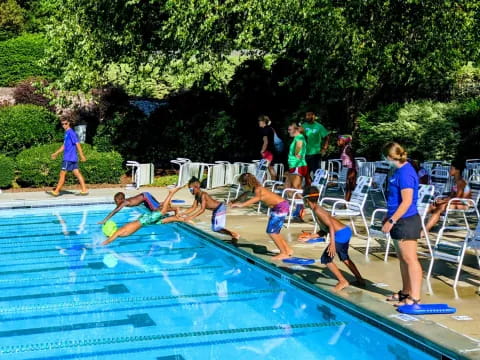 a group of people playing in a pool