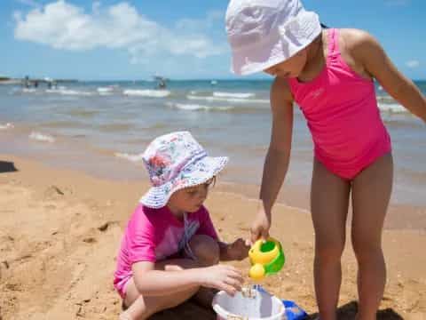 a woman and a child on a beach