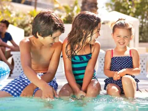 a group of children in a pool