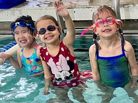 a group of children in a pool