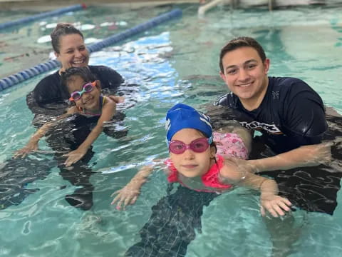 a group of people in a pool