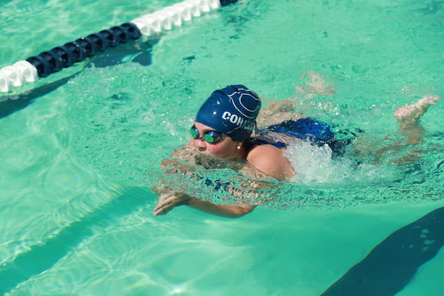 a person swimming in a pool