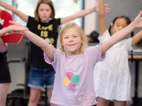 a group of children dancing