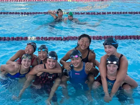 a group of people in a pool