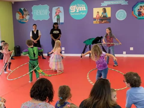 a group of children performing on a stage