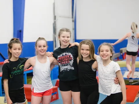 a group of girls posing for a photo