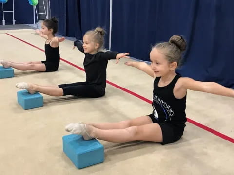 a group of girls doing yoga