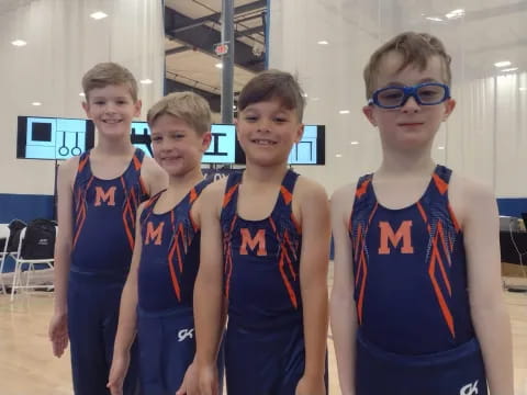 a group of boys in blue uniforms