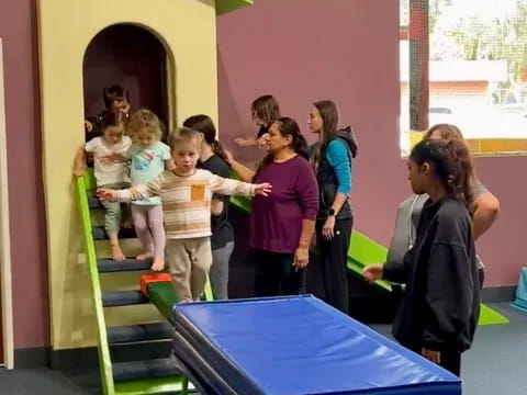 a group of children standing in a room