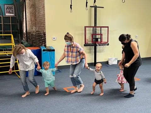 a group of people playing with toys