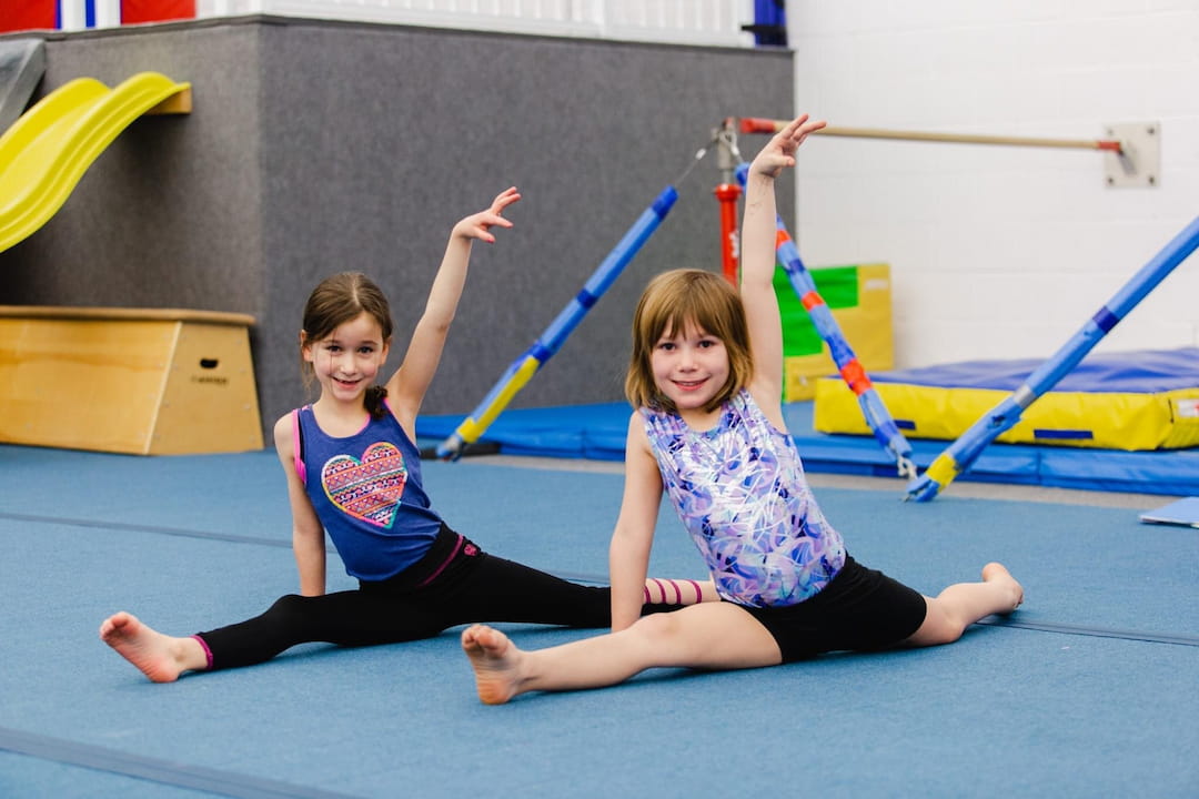 two girls on a mat